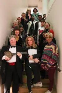 Ten Years of Queer Perspectives performers and curators! A group shot of the cast standing in one of the gallery stairwells