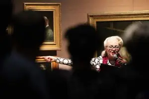 Bird la Bird pointing the finger. A long shot of Bird pointing to the painting of Babington Macaualy