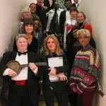 Ten Years of Queer Perspectives performers and curators! A group shot of the cast standing in one of the gallery stairwells