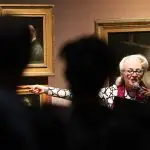 Bird la Bird pointing the finger. A long shot of Bird pointing to the painting of Babington Macaualy